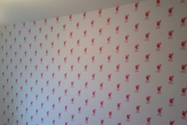 white wallpaper, patterned with the Liverpool football club logo