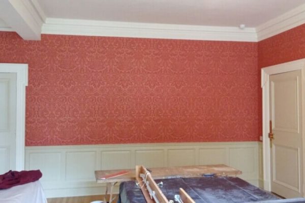 red wallpaper with embossed textured pattern
