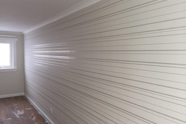 New wallpaper, white with horizontal silver lines of varying thickness placed parallel to each other