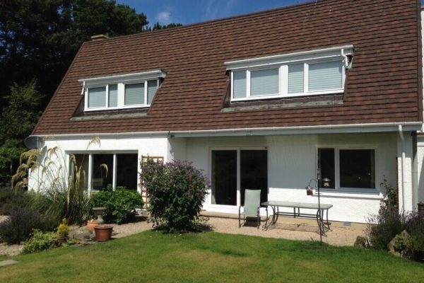 external view of a house with a fresh coat of white paint